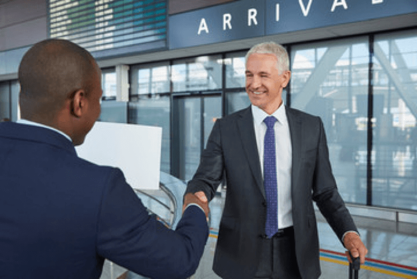 Chauffeur greeting a passenger at the airport arrivals terminal