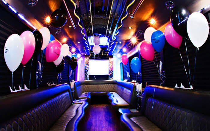 Party bus interior decorated with balloons