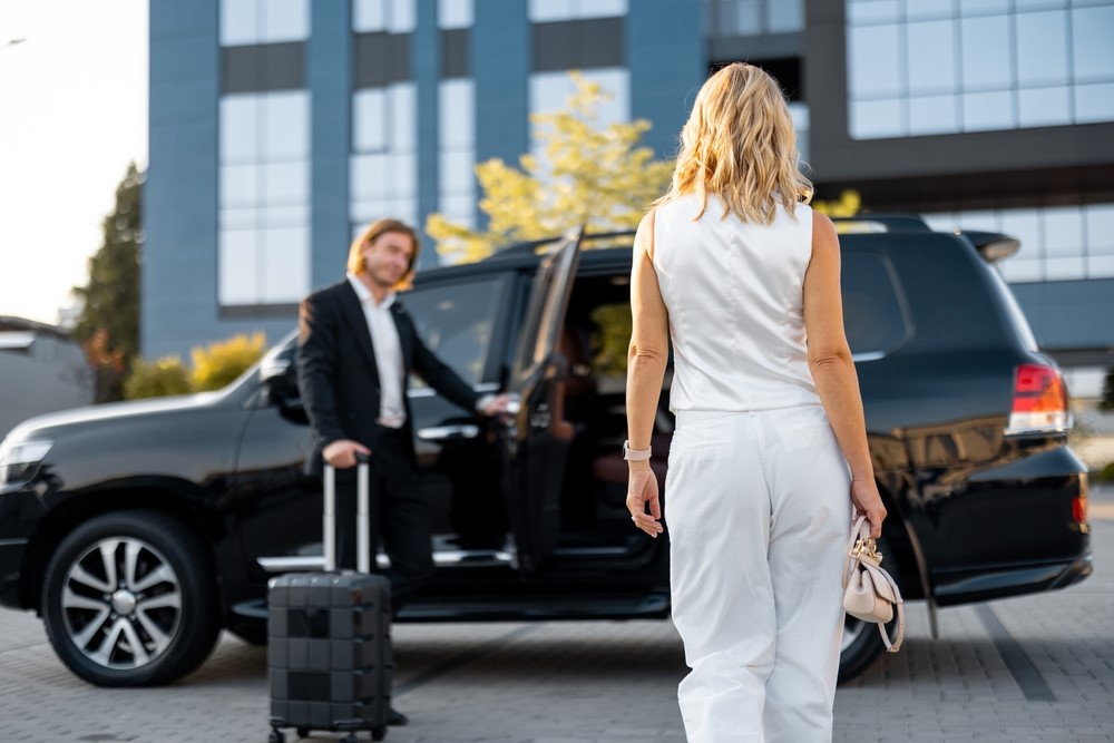 Chauffeur holding the SUV door for a passenger in North Hills