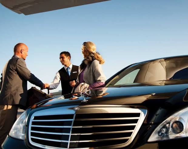 Chauffeur greeting guests for a Universal Studios ride